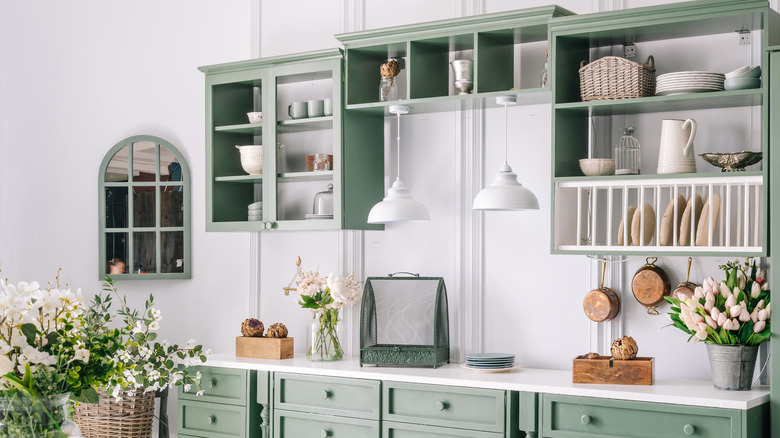 arched mirror in green kitchen