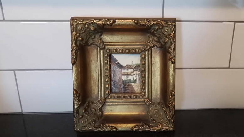 small framed artwork covering outlet