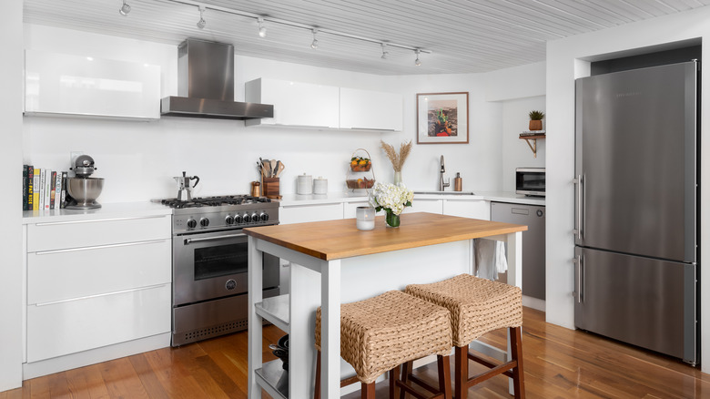 artwork above kitchen sink