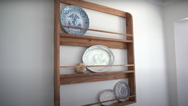 plates in wooden plate rack