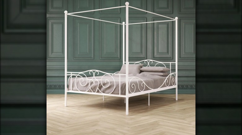 White metal canopy bed