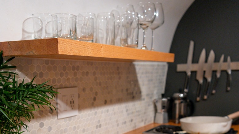 wooden kitchen shelf with glasses