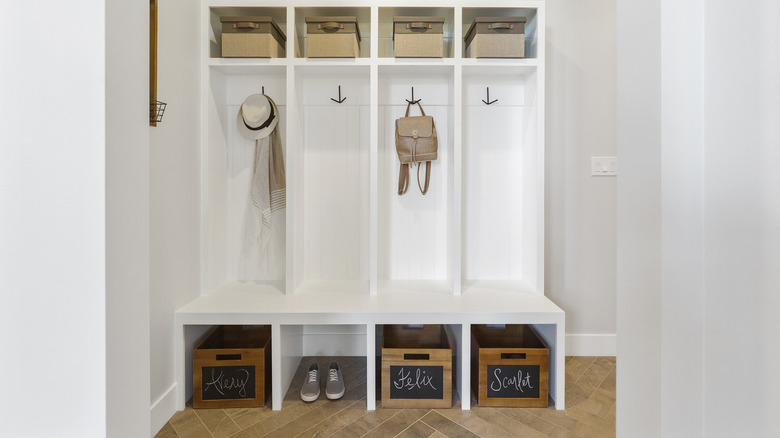 mudroom with labeled bins