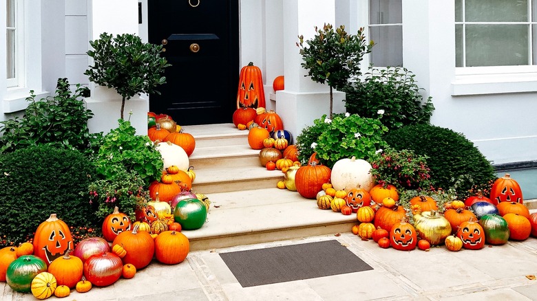 gourds and pumpkins decorate porch