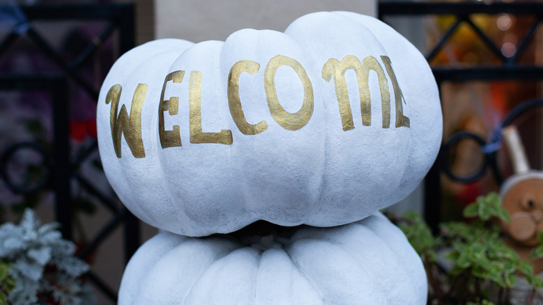 white pumpkin with welcome painted