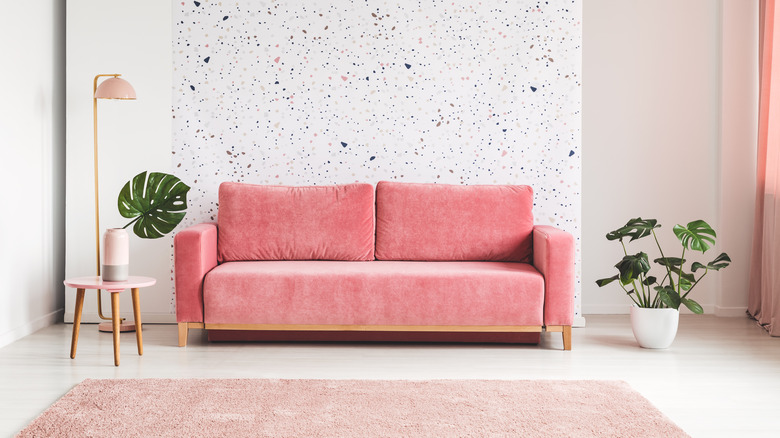 pink couch on wall