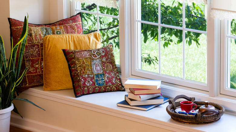 patterned pillows on reading nook
