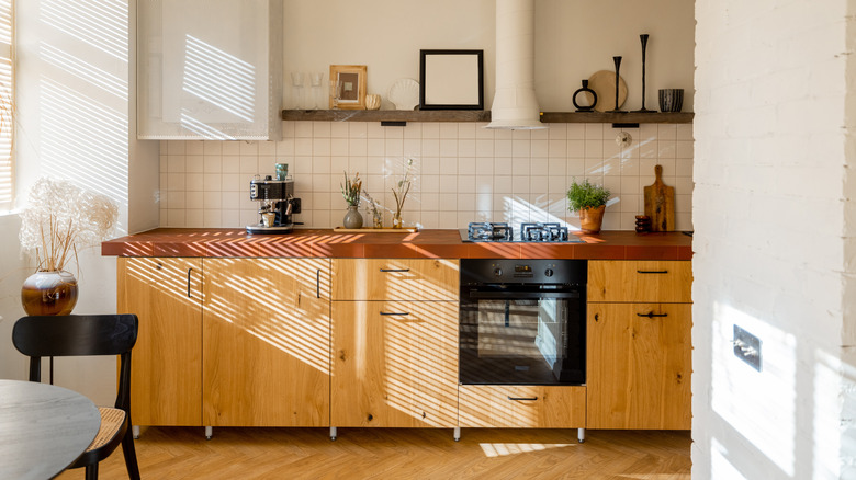 Yellow toned kitchen cabinetry 