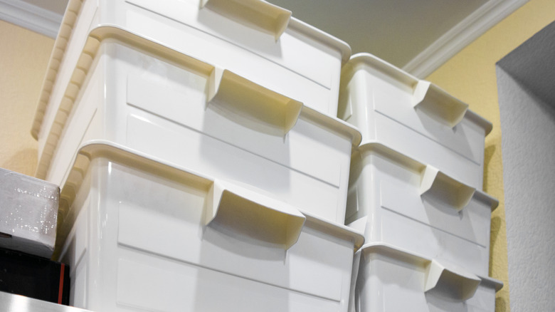 White opaque bins stacked