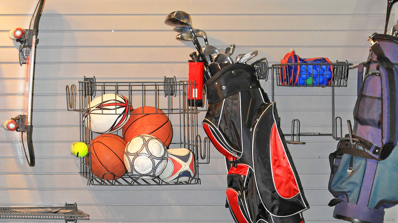 Sports gear on slat wall