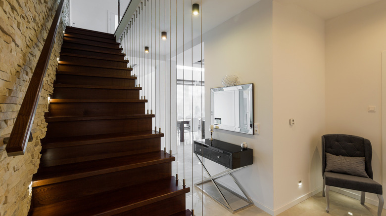 Stylish wooden stairs in modern elegant hallway