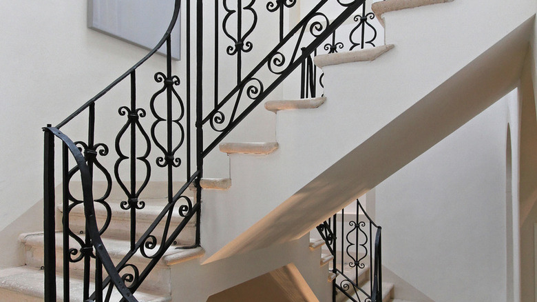 stairs with iron banister