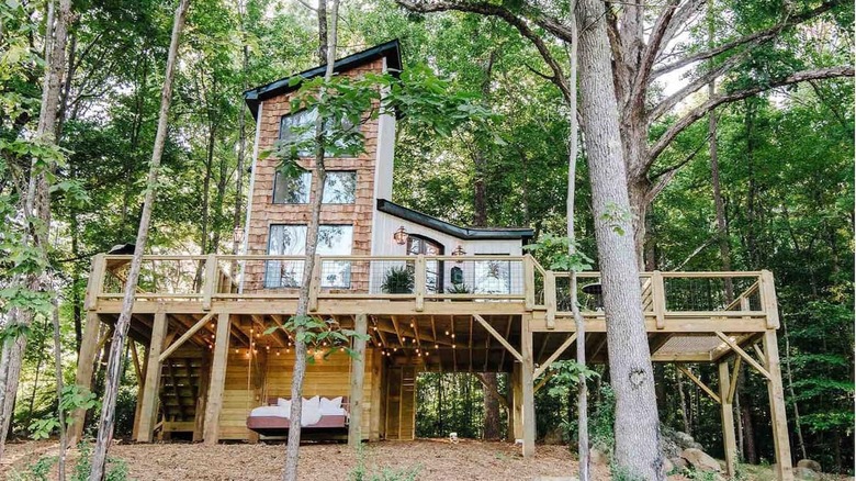 contemporary treehouse in the woods