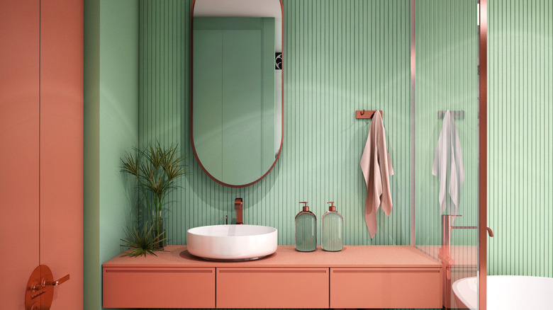 mint green and coral bathroom