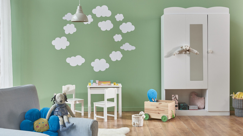 mint green playroom with clouds