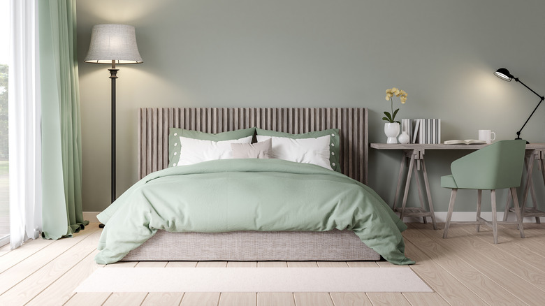 mint green bedding on bed