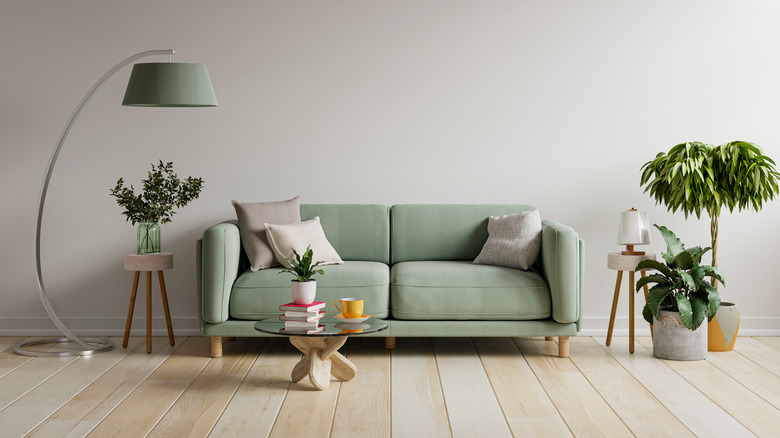 mint green couch and lamp