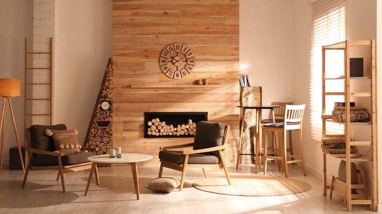 wooden clock above a fireplace