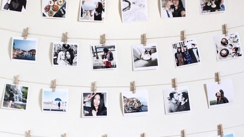 polaroids hung on wall 