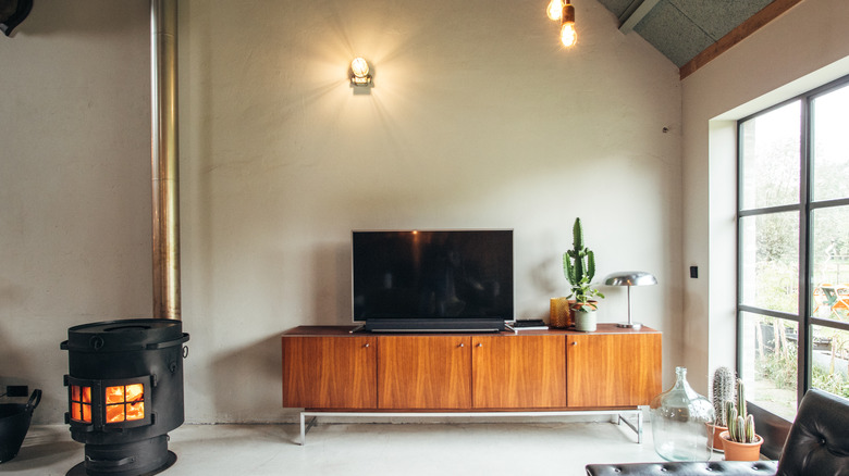 a chic bedroom with a TV