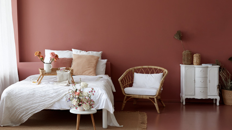 bedroom with maroon walls 
