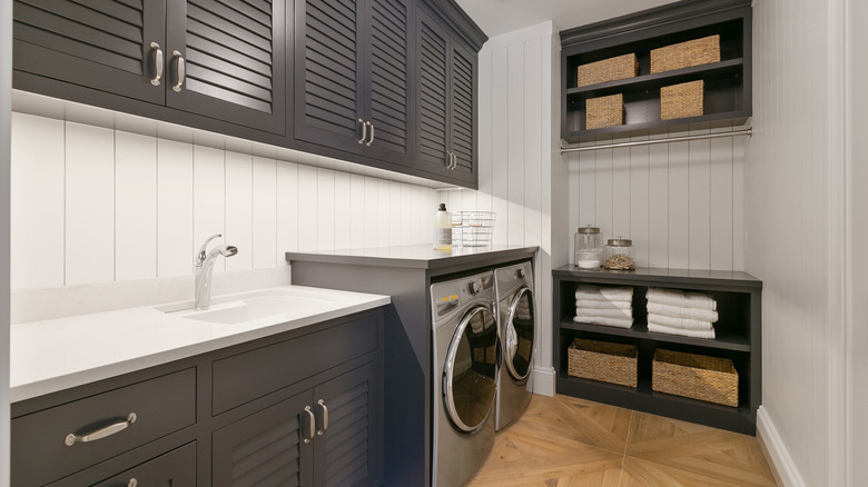 Gray and white laundry room