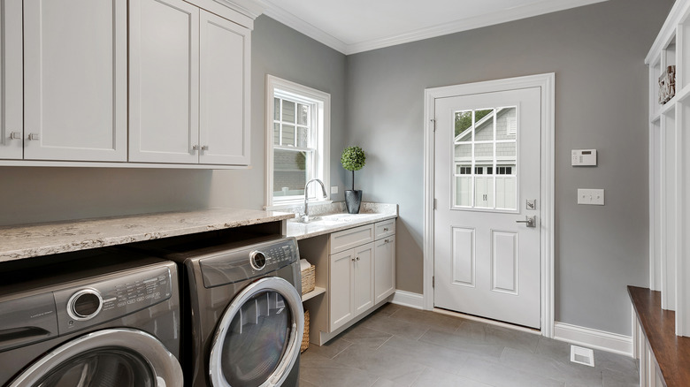 Gray laundry room with mudroom