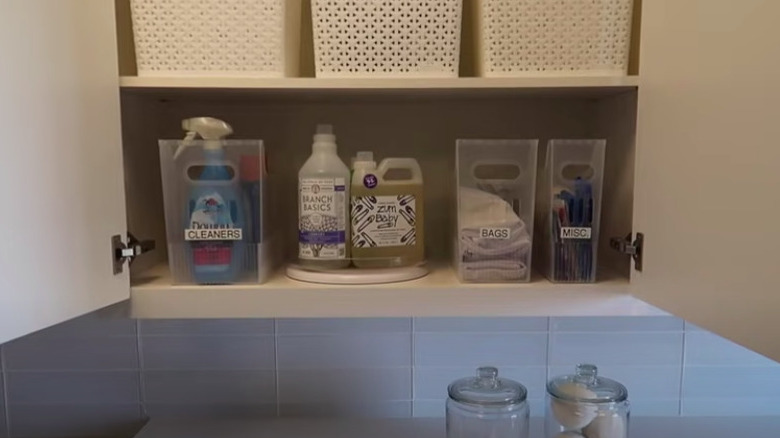 Laundry items organized in cabinet