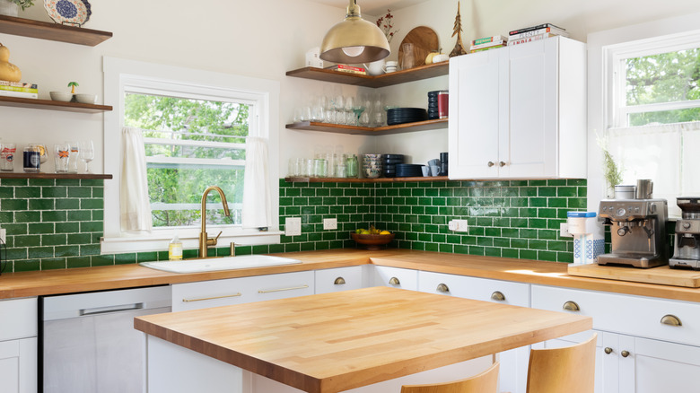 green backsplash with wooden countertops