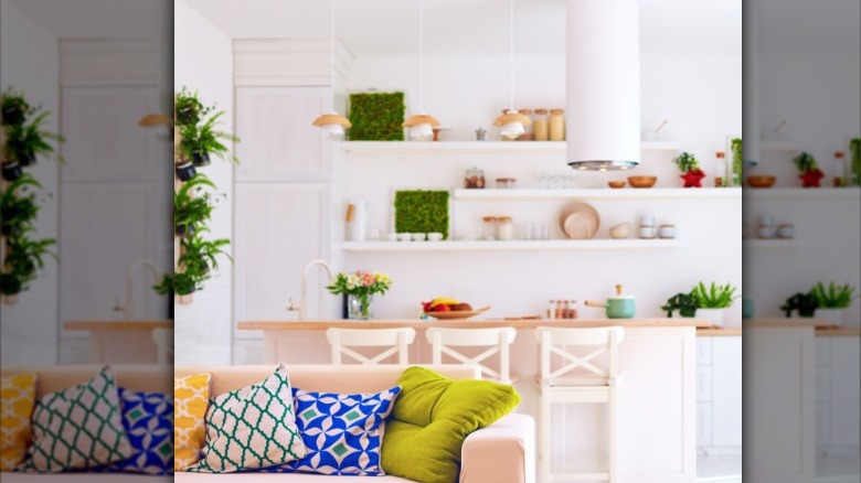 patterned pillows near white kitchen