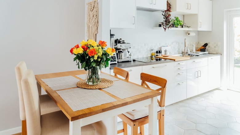 hanging tapestry in white kitchen