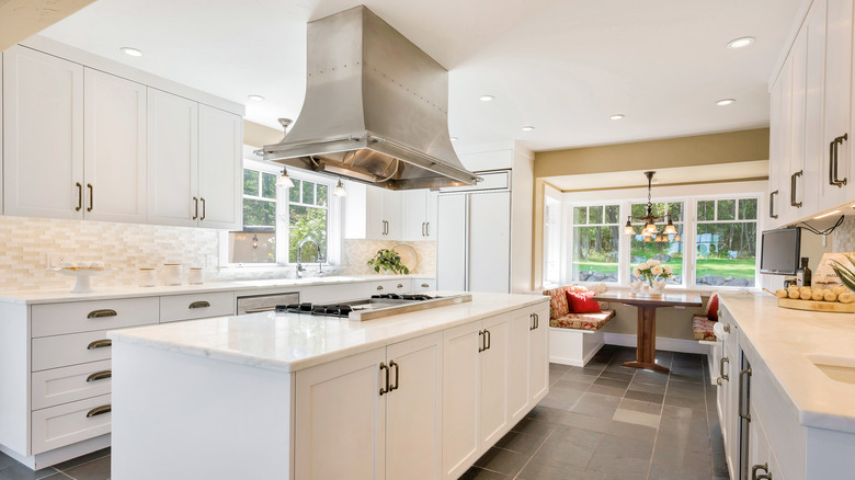 white kitchen with beige backsplash