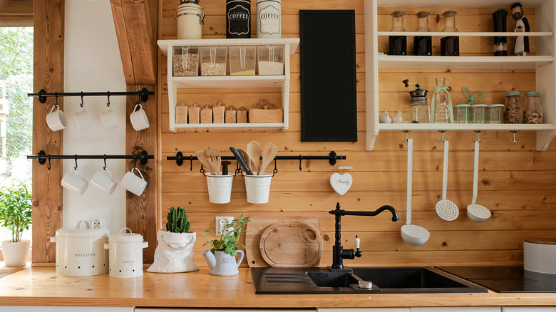 wooden wall behind kitchen sink