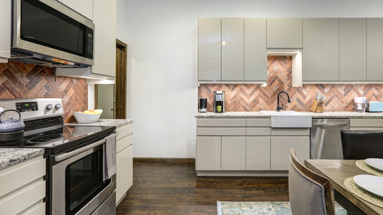 herringbone red brick kitchen backsplash