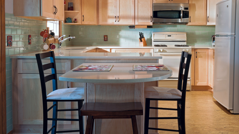 green tiles with wooden cabinets