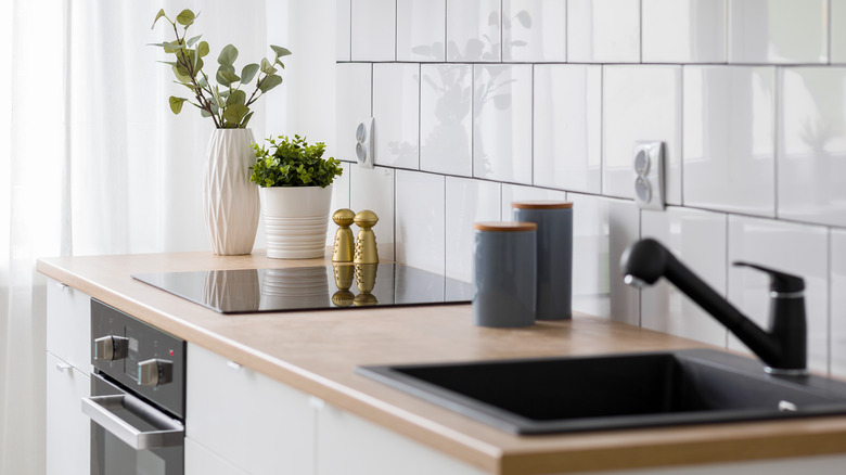 white square tiled kitchen backsplash