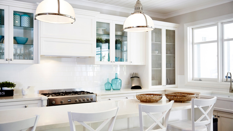 aqua accessories in white kitchen