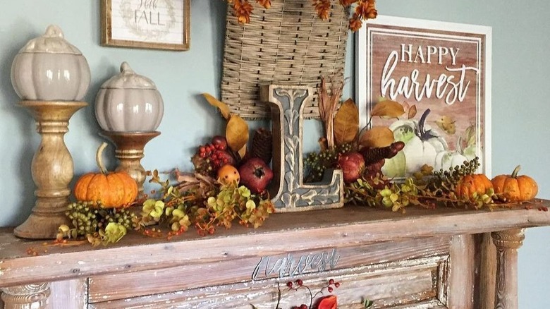 fall decorations on antique fireplace