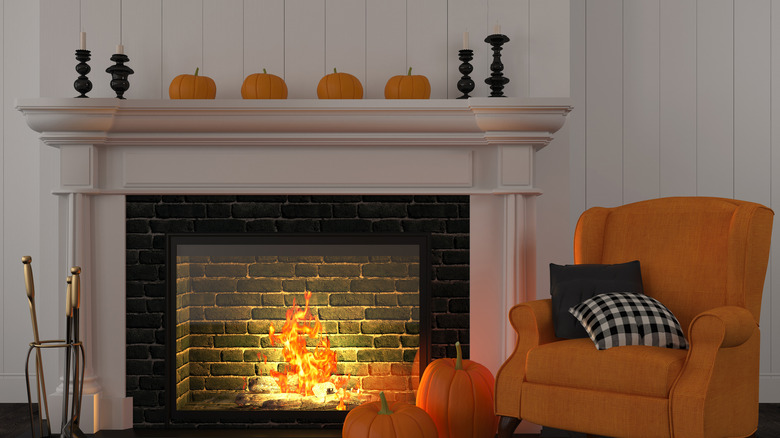 Orange chair by fireplace