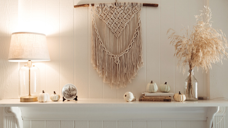 White pumpkins on boho mantel