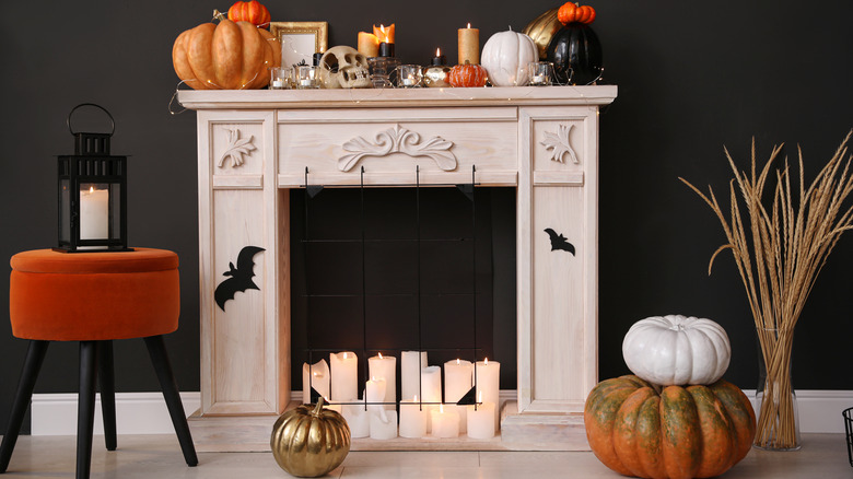 Assortment of gourds in front of mantel