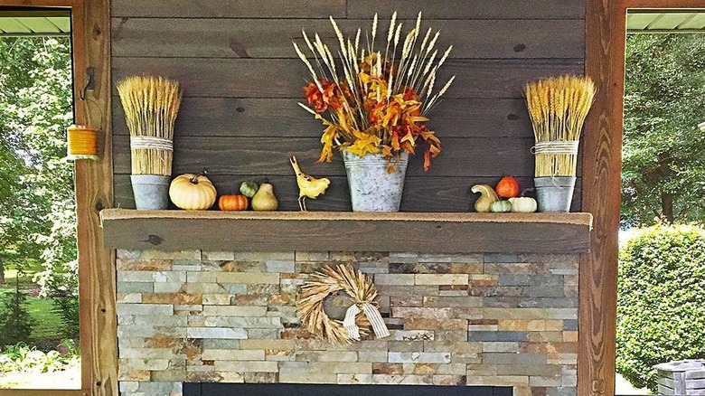 Fall decorated outdoor fireplace