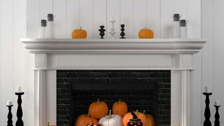 Pumpkins spilling from fireplace