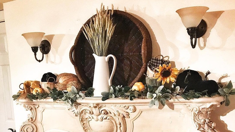 Pumpkins and sunflowers on mantel