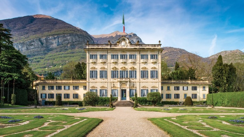 stately mansion with a flag