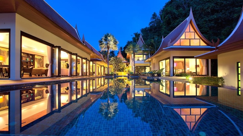 palm-lined Thai mansion