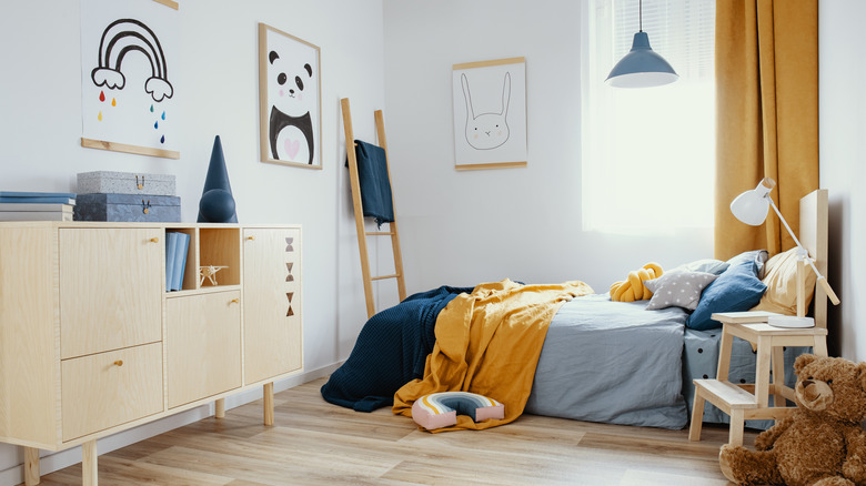 a blue and mustard yellow boys room 