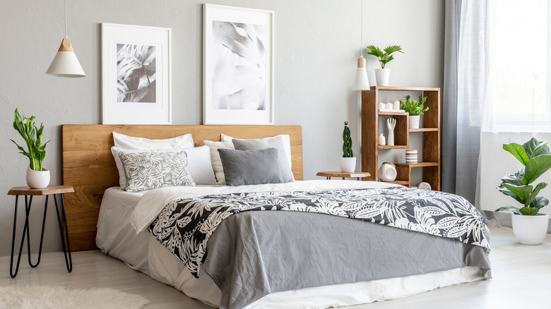 Framed pictures over wood headboard