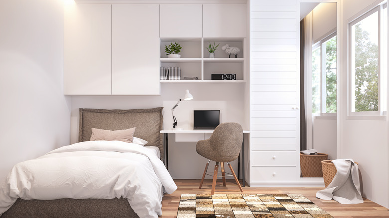 White bedroom desk and cabinetry