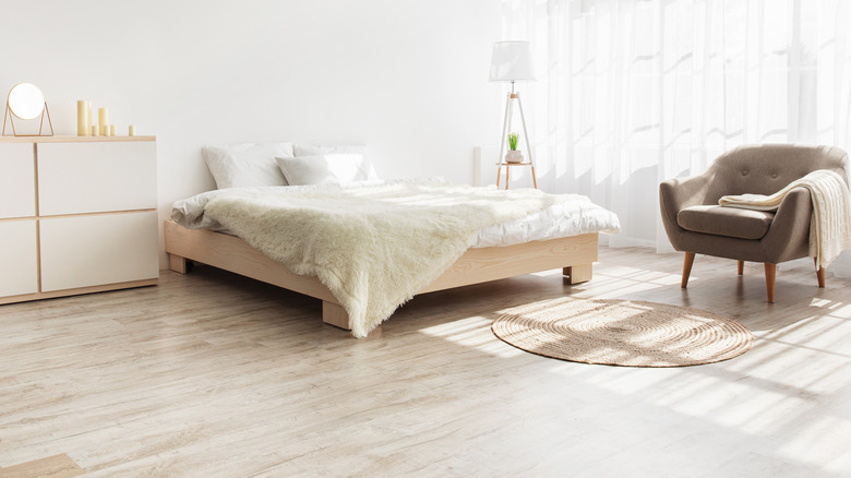 Light-wood flooring in Scandi bedroom